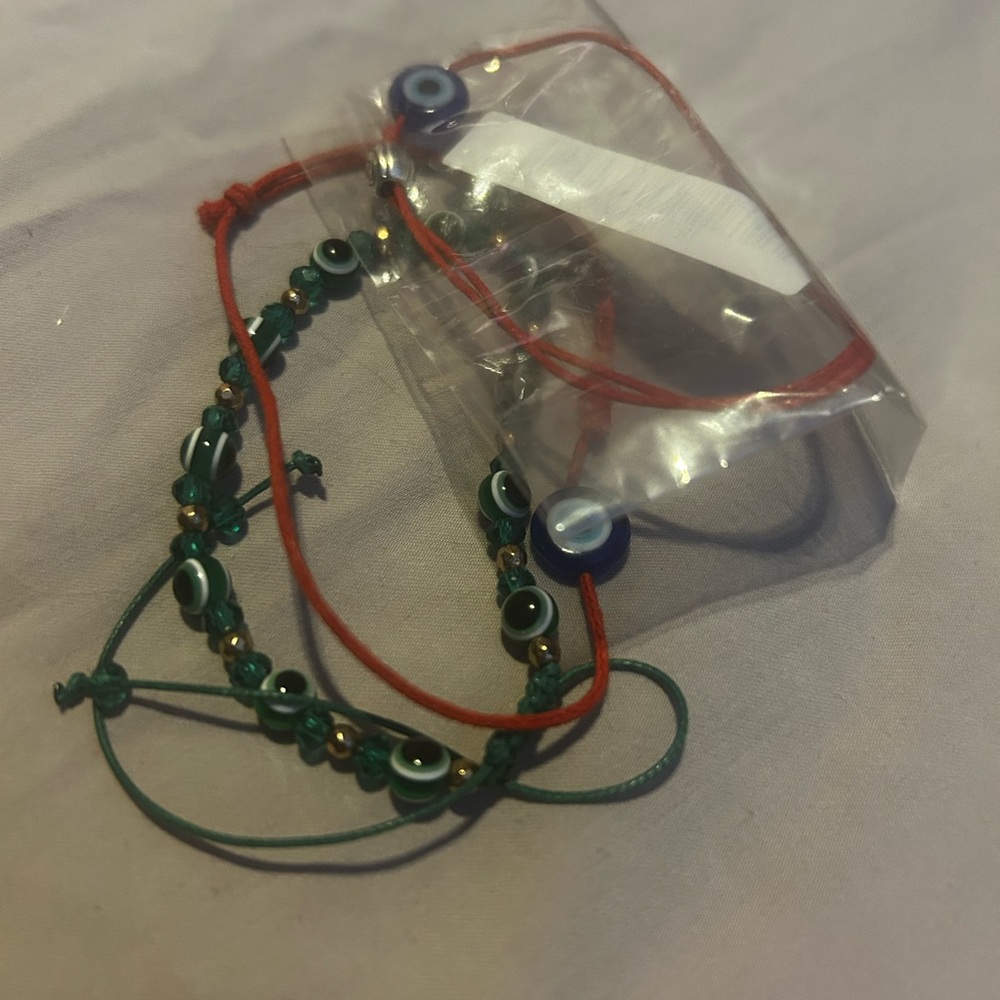 Evil eye bracelet draw string and red string